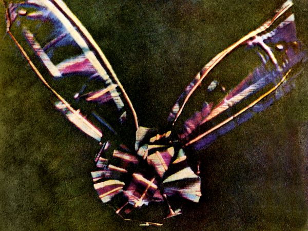This is thought to be the first colour photograph, created by Scottish physicist James Clerk Maxwell in 1861. He created the image by photographing the ribbon through red, blue, and yellow filters, then combining them into one composite image.