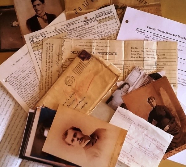 Before: What to do with all of these inherited papers, documents, and photographs? Classify, Combine, and Conserve. (Credit: Kate Eakman)