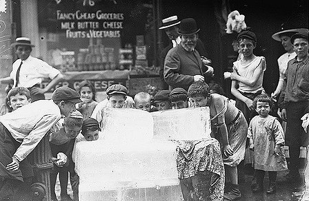Licking blocks of ice on a hot day, c1910 (Credit: Library of Congress)