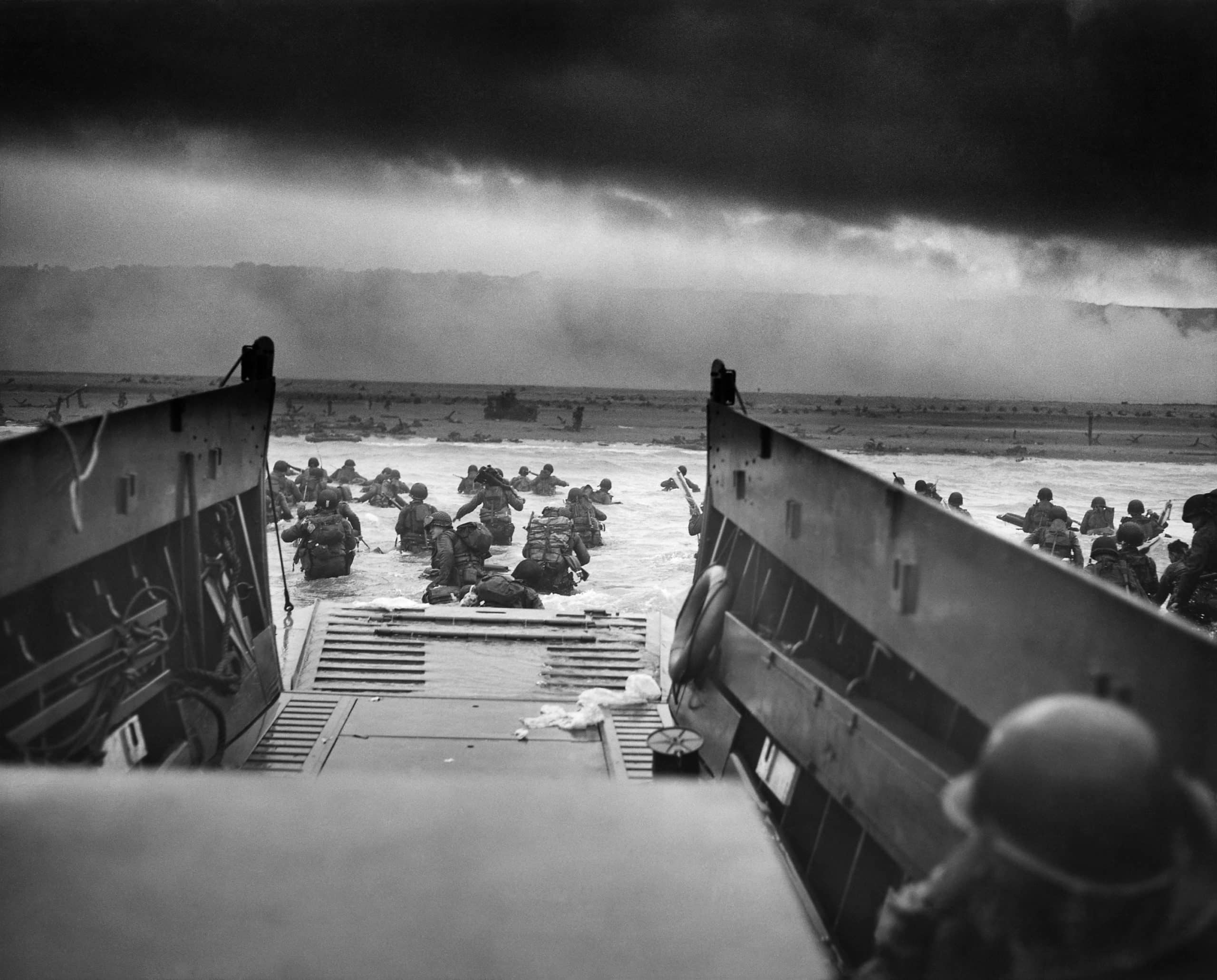 A LCVP from the U.S. Coast Guard-manned U.S.S. Samuel Chase disembarks troops of Company E, 16th Infantry, 1st Infantry Division wading onto the Fox Green section of Omaha Beach