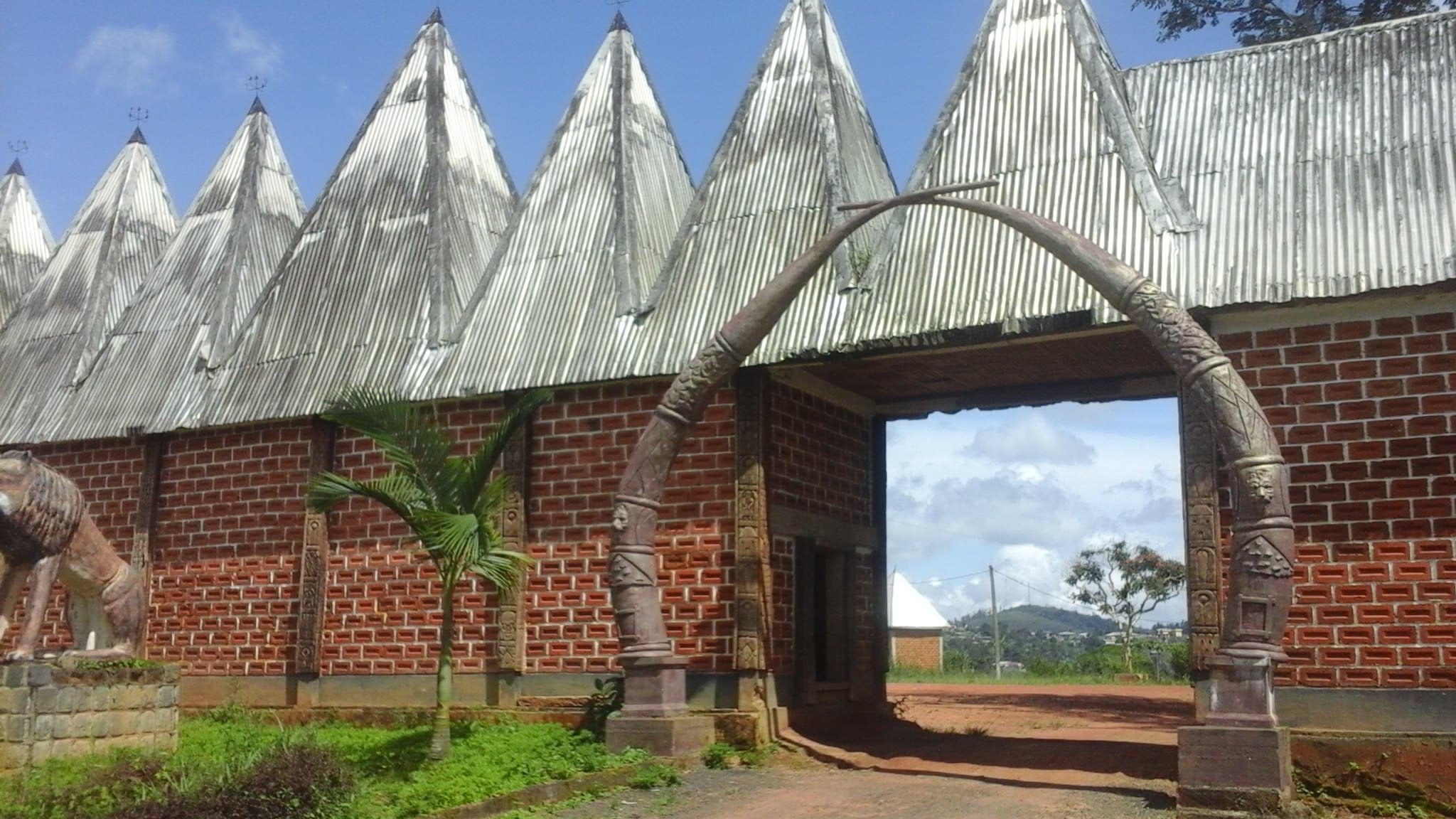 Photo of the entrance to the Bazou Chieftaincy, home of the Bamileke people in Bandounga, Cameroon.