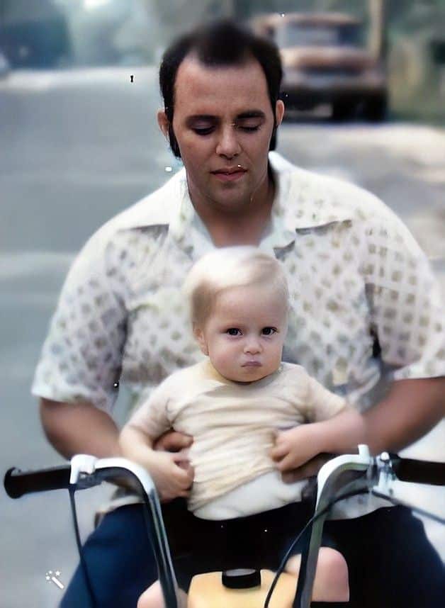 Carl with his adoptive father, Paul De Lio. Photo enhanced and colors restored by MyHeritage