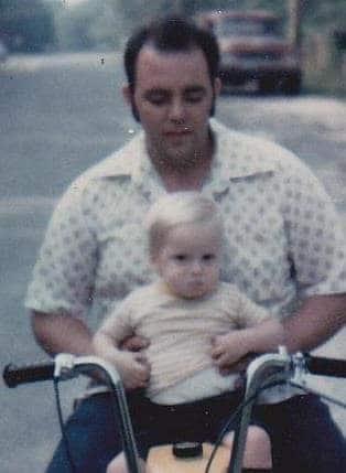 Carl with his adoptive father, Paul De Lio. Photo enhanced and colors restored by MyHeritage