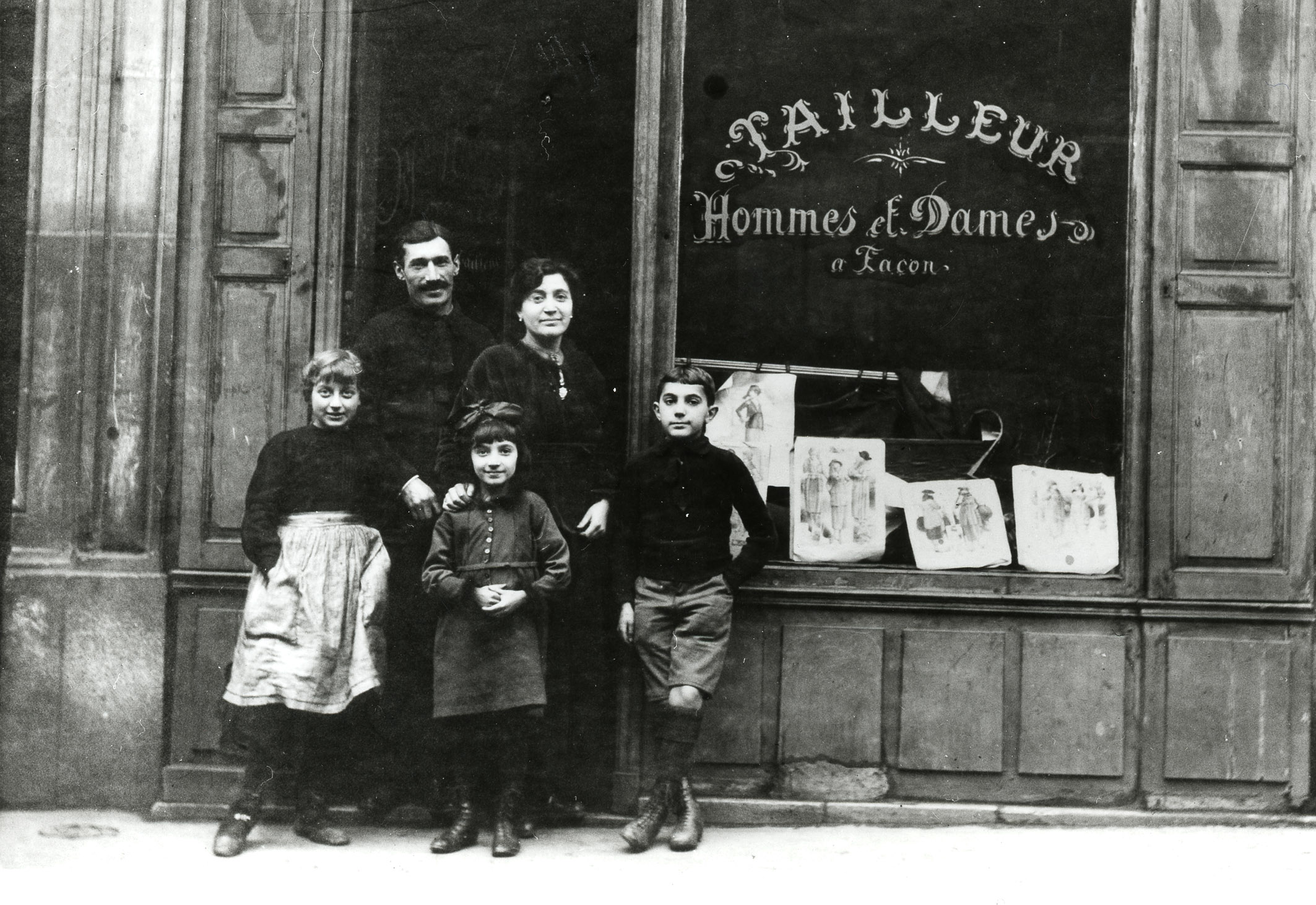 Pierre and Mina Haas in front of their shop, with their children Alice and Nathan, and their cousin Juliette Zisermann (left). Photo colorized and enhanced by MyHeritage