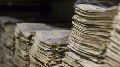 What Hidden Clues Can Obituaries and Newspaper Archives Provide?