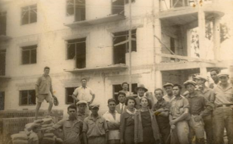 Travel back in time: The same building in the early 1930s, when the Chwojnik hospital was being built. My grandmother Chana Chwojnik is at the center, wearing a white scarf, and next to her is her aunt Ettia Mednitzky, wife of Dr. Chwojnik.