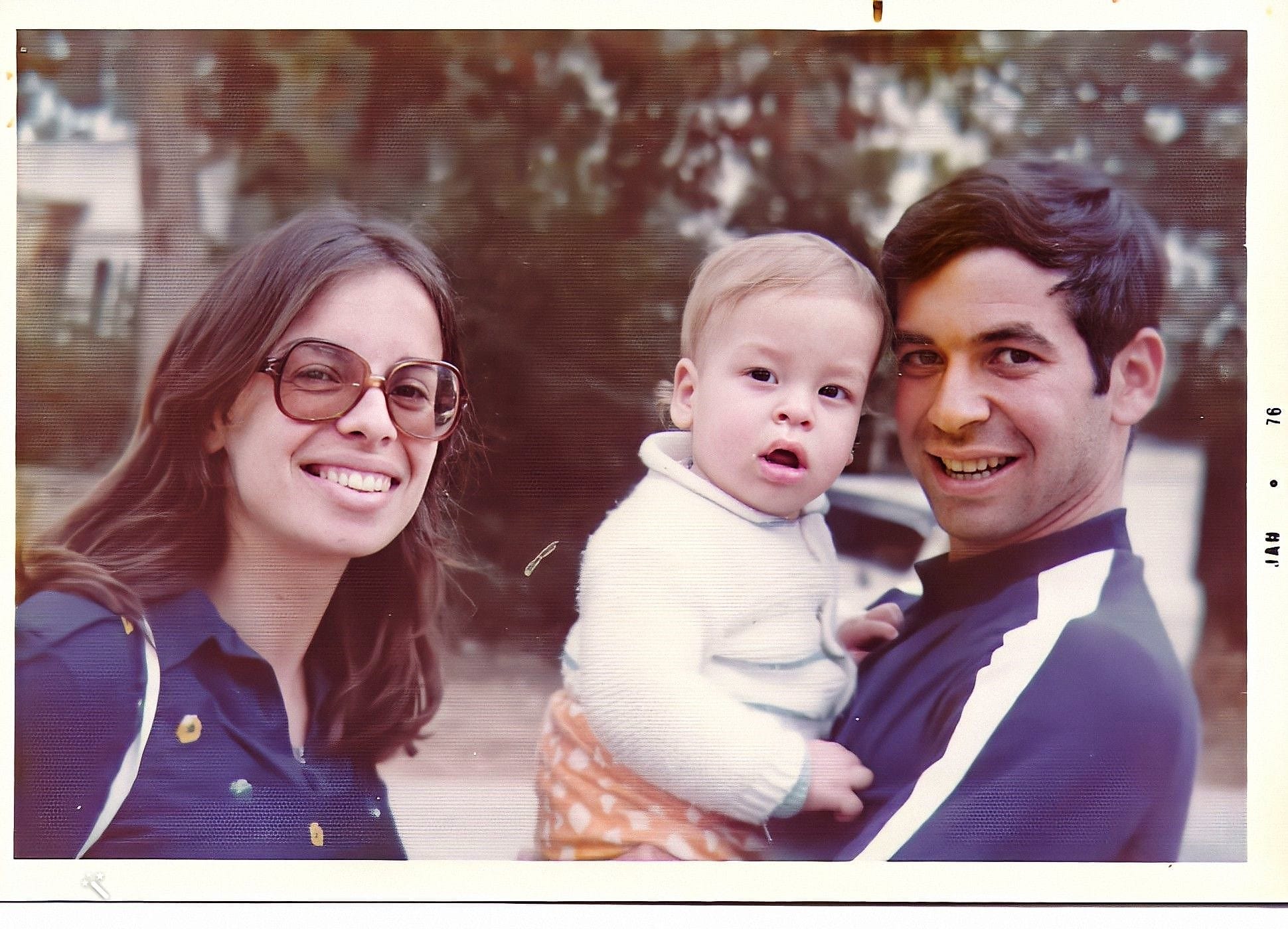 Maya and Menachem Schneider, holding Oren as a baby, 1975