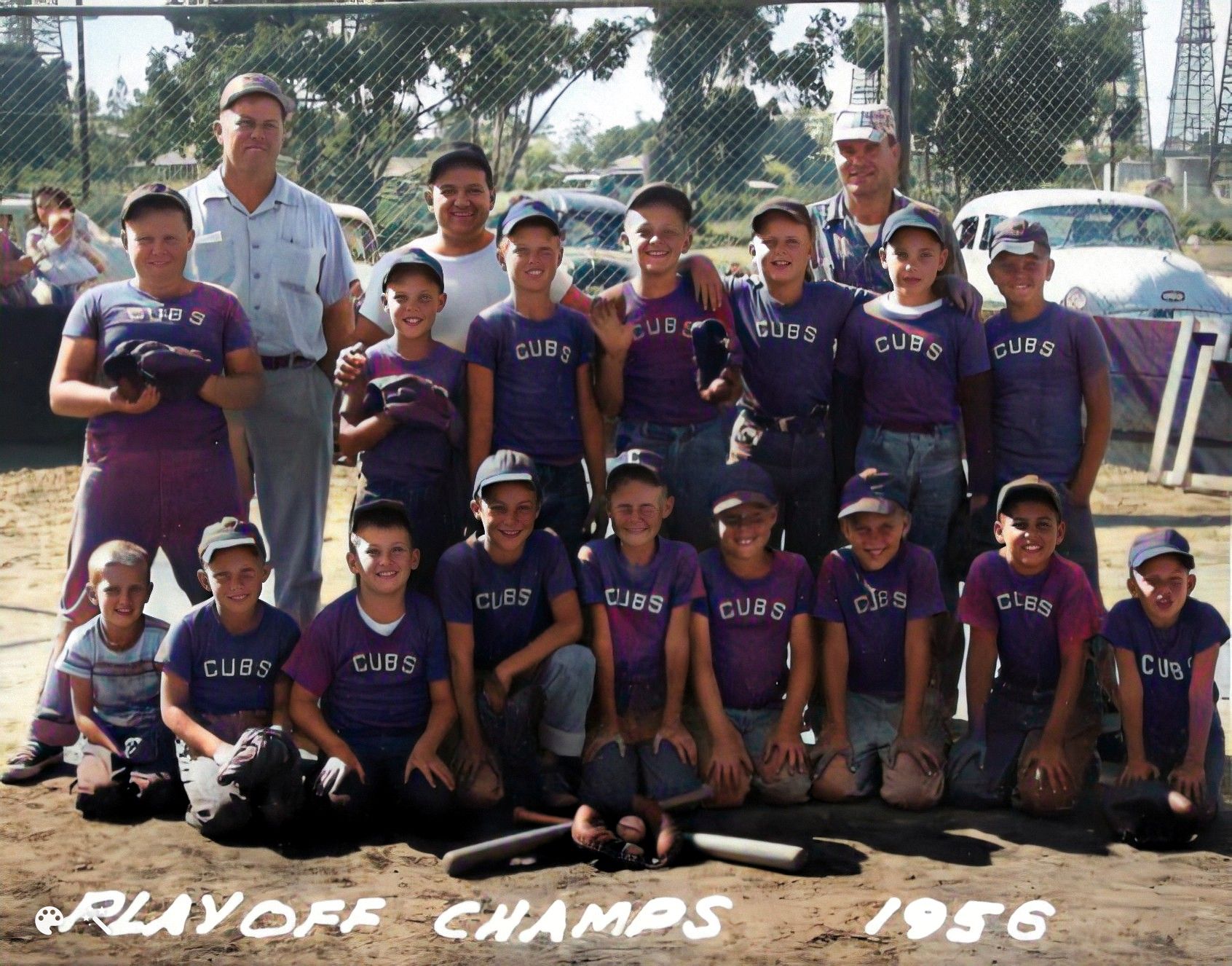 George in the back far right. His son Ron is standing third from right, and sitting first on the left is his son David. Photo enhanced and colorized by MyHeritage