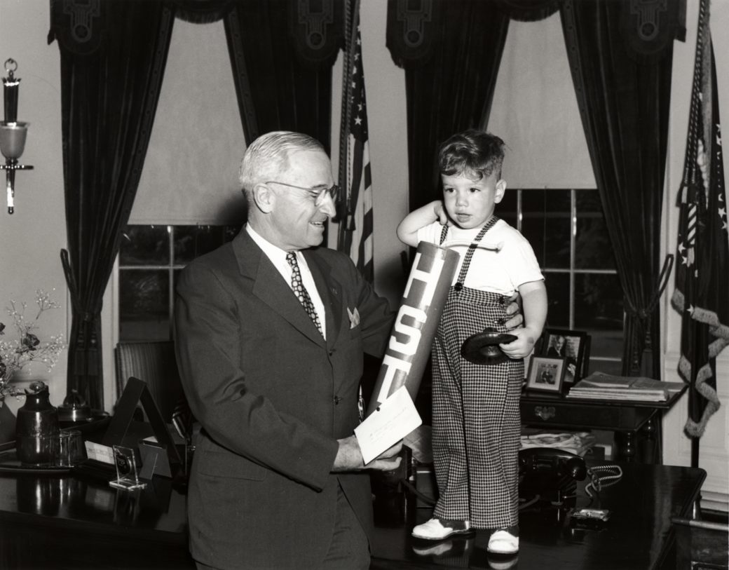 President Harry S. Truman receives the gift of a firecracker from a young boy in the Oval Office of the White House, July 4, 1947. Courtesy of the Library of Congress