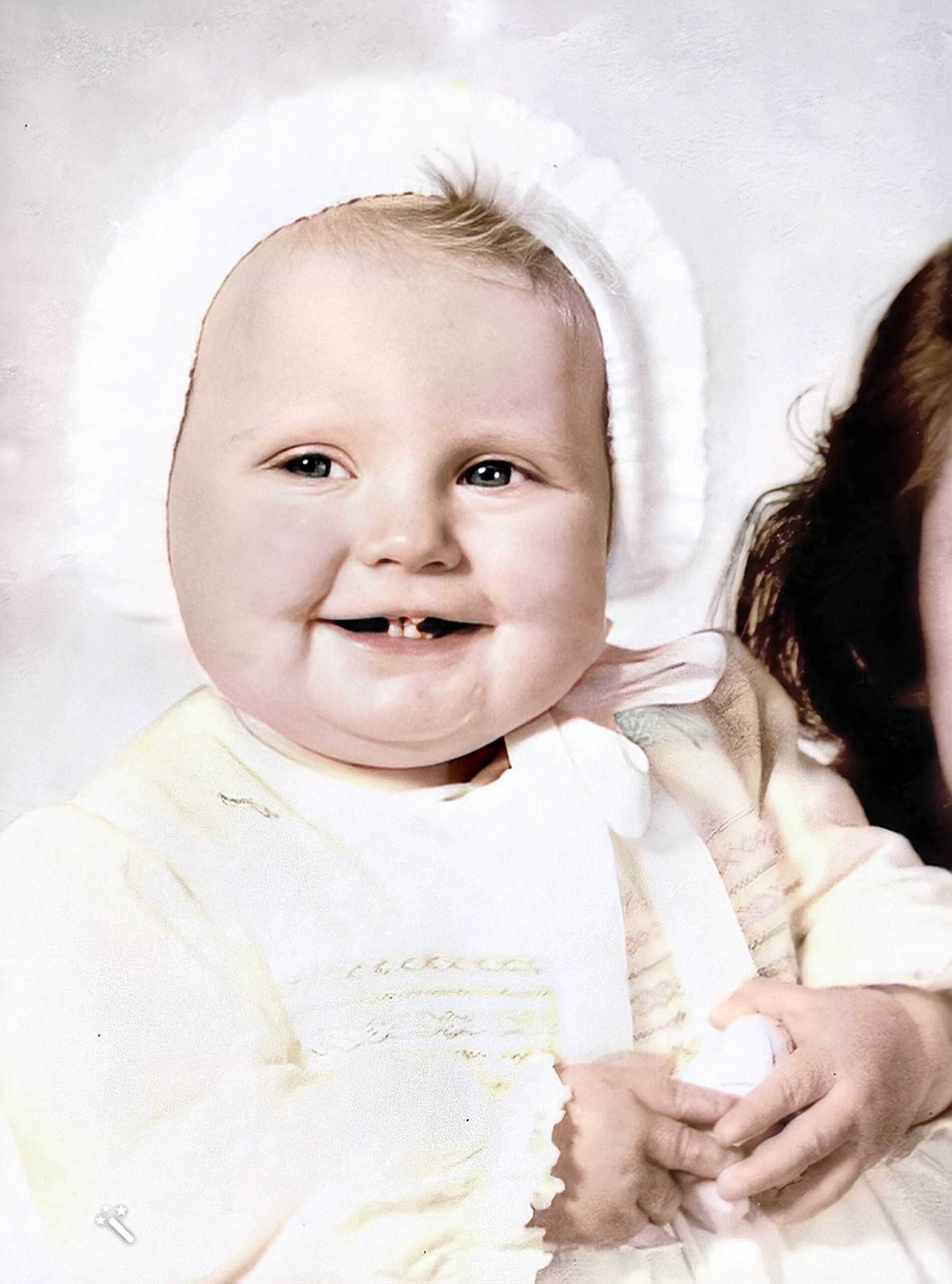 Suzy as a baby. Photo repaired, enhanced, and color-restored by MyHeritage