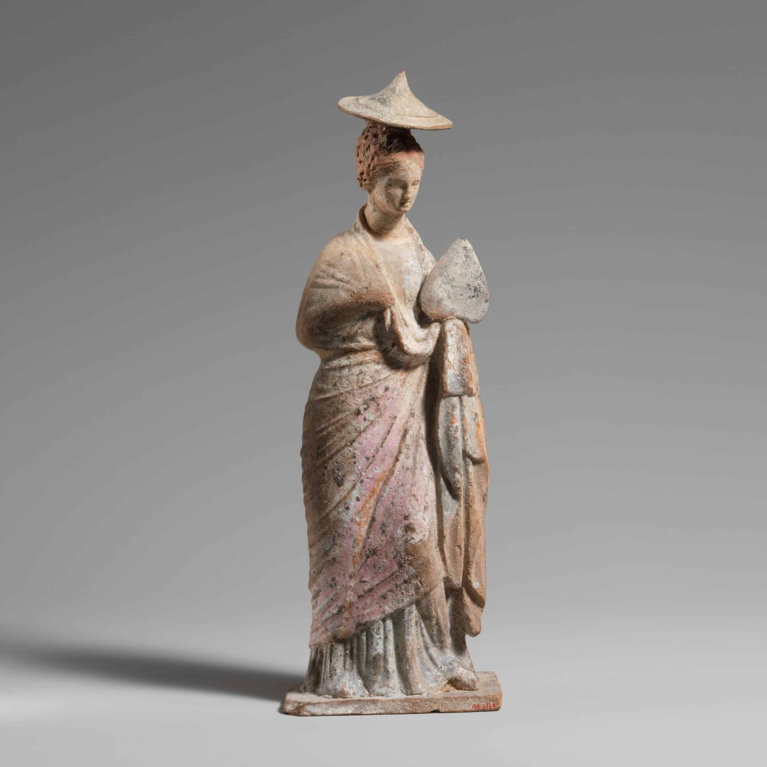 Colored Greek statues: a terrocotta statuette of a woman from 3rd century B.C.E. Greece