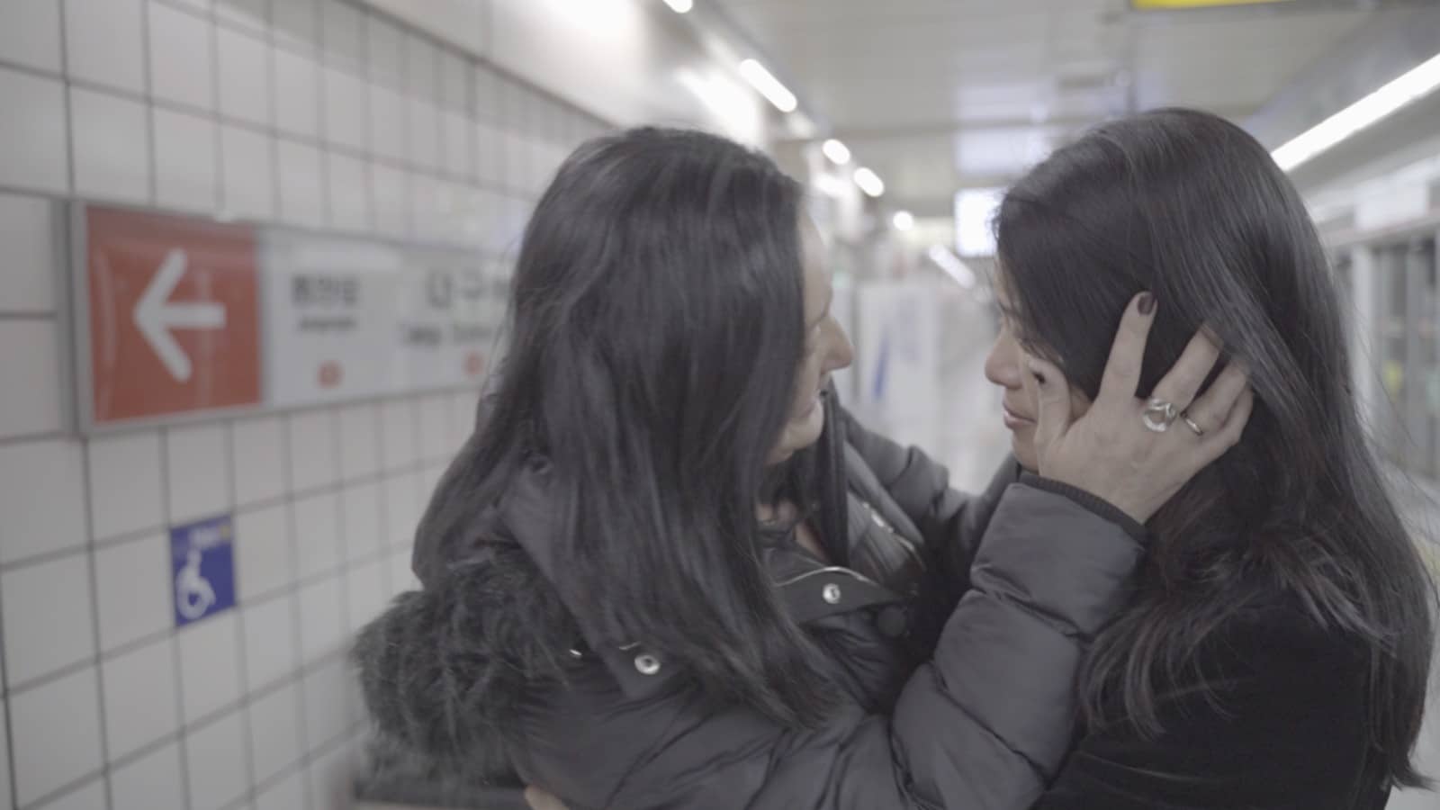 Christine and Kim meet for the first time on the subway platform in Daegu where they were abandoned.