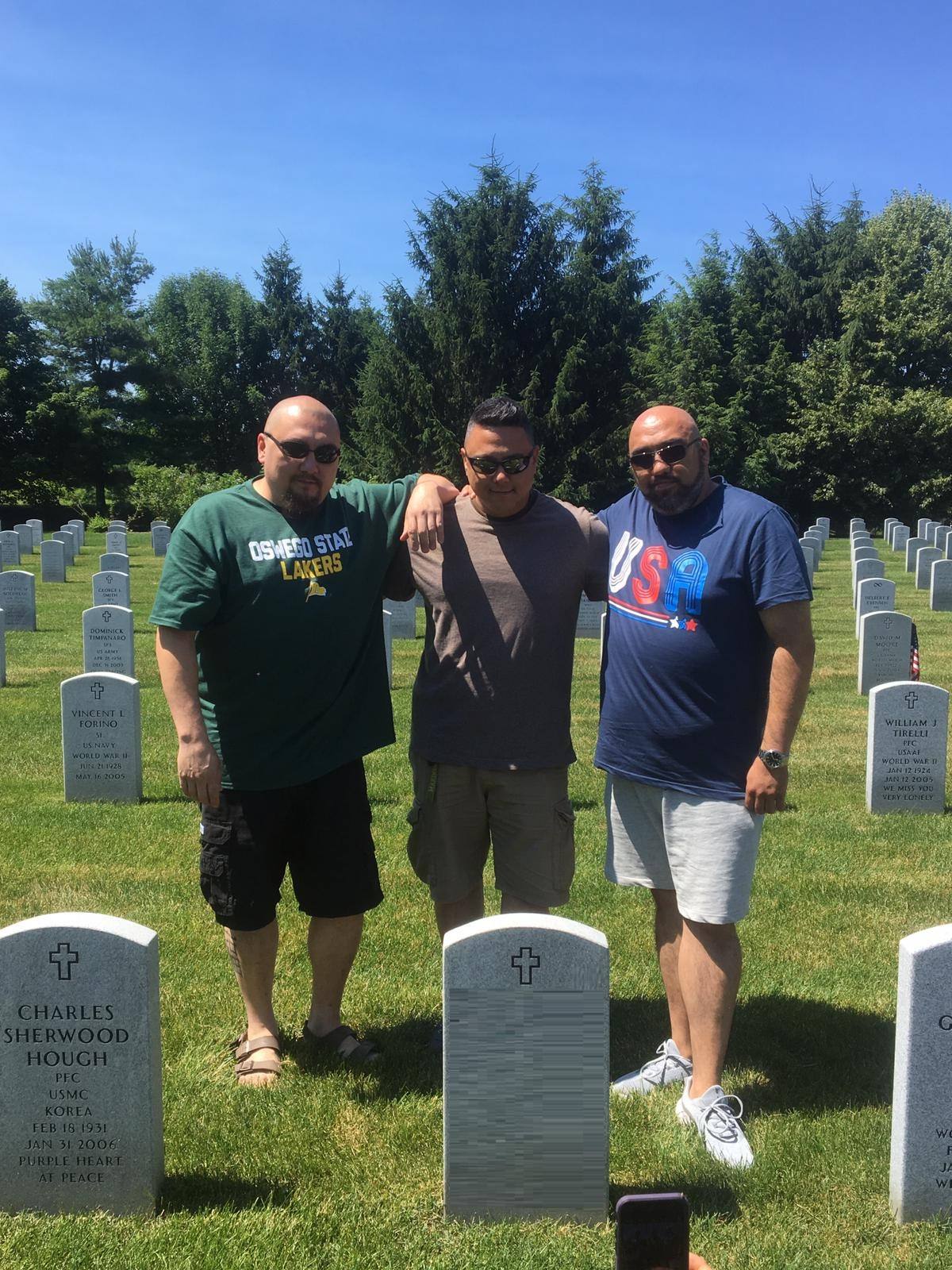 Johannes and his biological brothers visit their father’s grave together