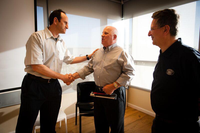 MyHeritage Founder and CEO Gilad Japhet greets Shep as MyHeritage senior researcher Laurence Harris looks on. (Click to view in full size)