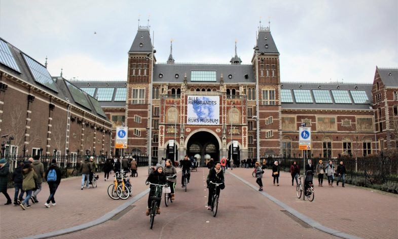 Cyclists in front of the Rijks Museum in Amsterdam