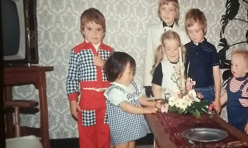 Kim as a child in Belgium with her adoptive family