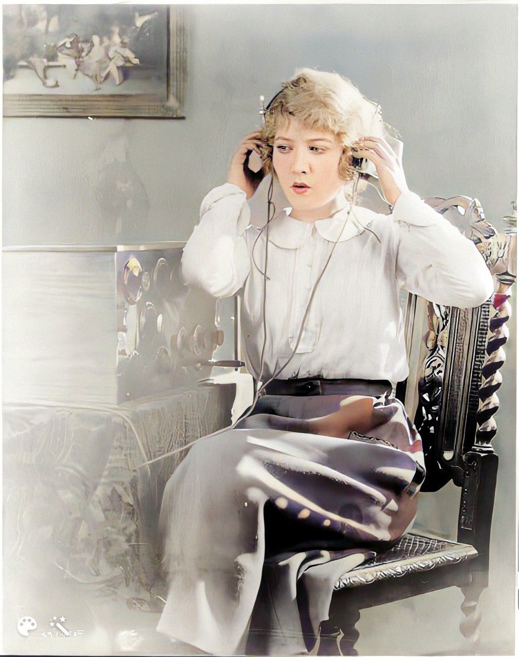 Woman listening to the radio, circa 1920. Photo colorized and enhanced by MyHeritage
